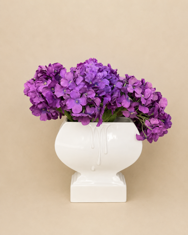 Purple floral Arrangement in Sculpted Ceramic Vase