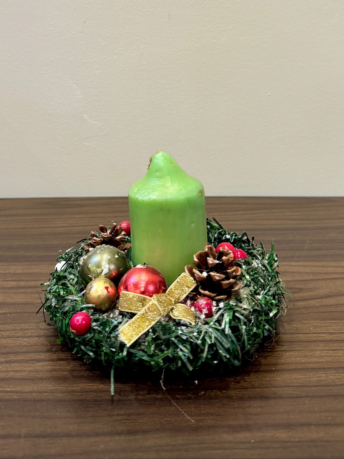 Green candle Christmas centrepiece