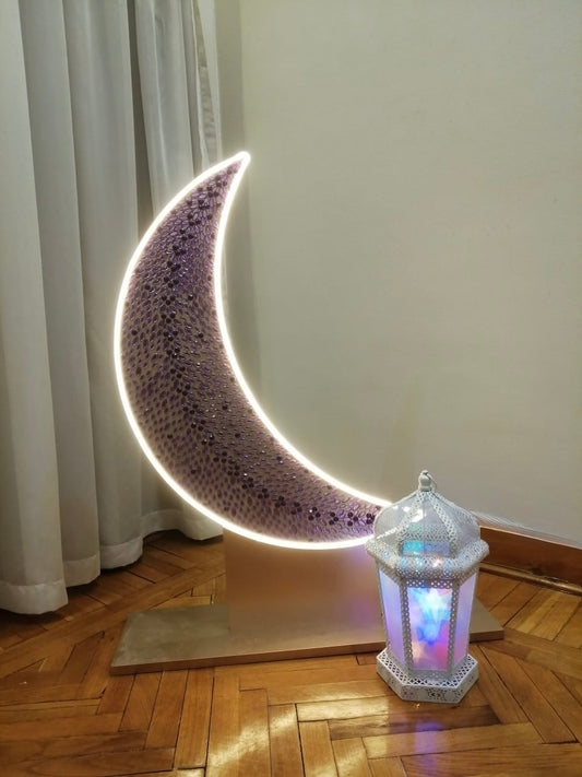 Radiant crescent with glowing white lantern