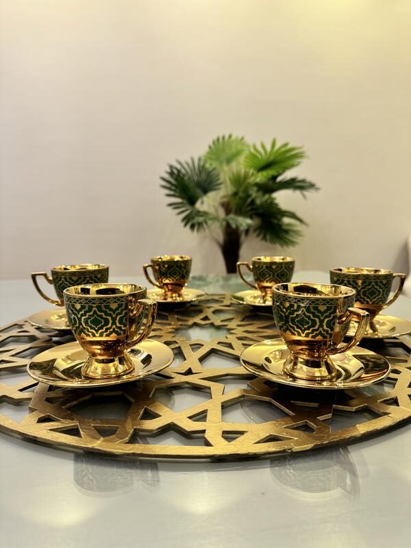 Gold and blue coffee cups and plates with large coaster