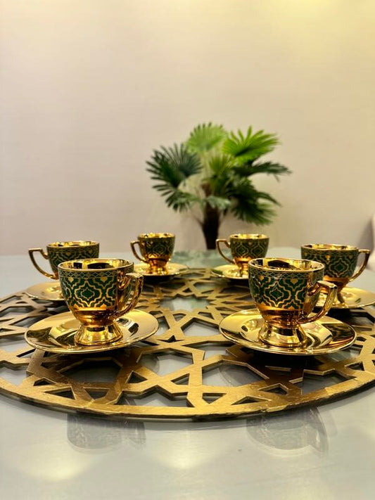 Gold and blue coffee cups and plates with large coaster