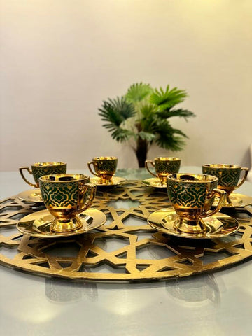 Gold and blue coffee cups and plates with large coaster