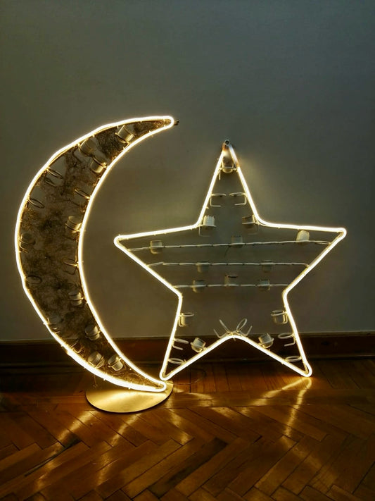 Lit crescent moon and star decoration with coffee cup holders