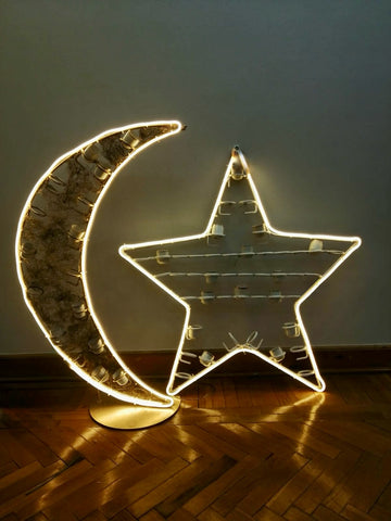 Lit crescent moon and star decoration with coffee cup holders