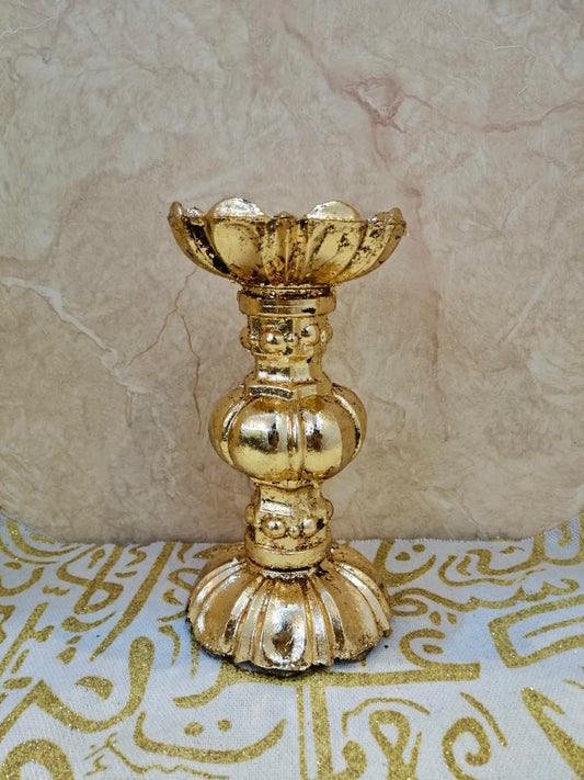 Tall gold candle holder