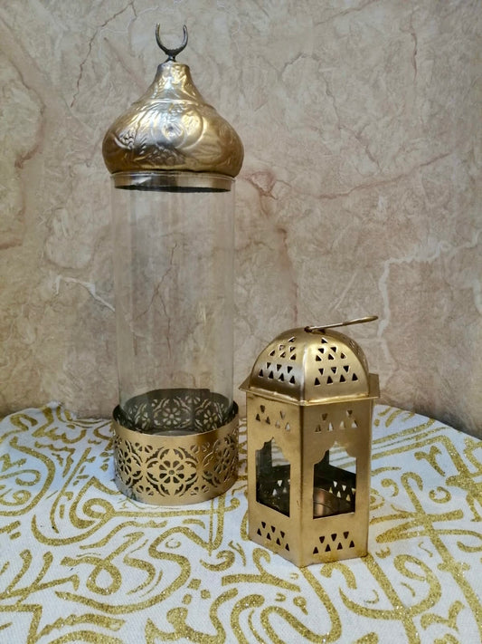 Gold lantern and glass holder with intricate patterns