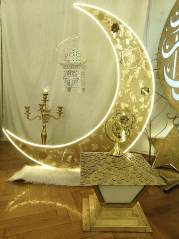 Large gold metal crescent with white and gold lantern