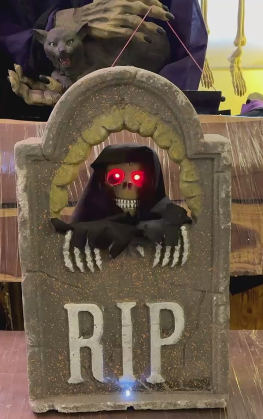 Tombstone with skull