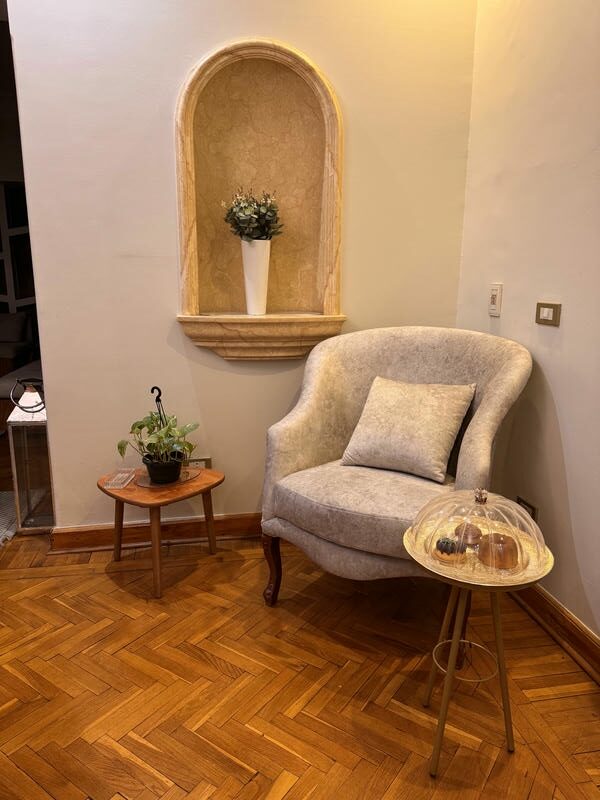 A chic gold side table with a sleek tripod design