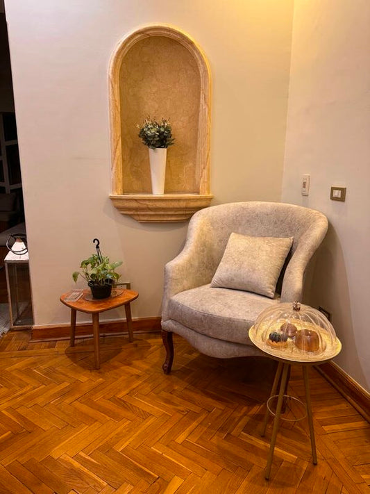 A chic gold side table with a sleek tripod design